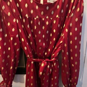 Beautiful gold and crimson dress with ruffle hem & cuff.